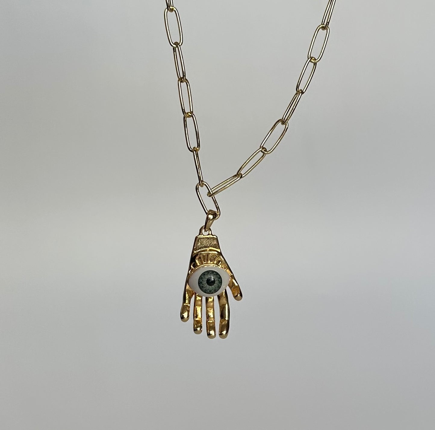 Collar manita ojo