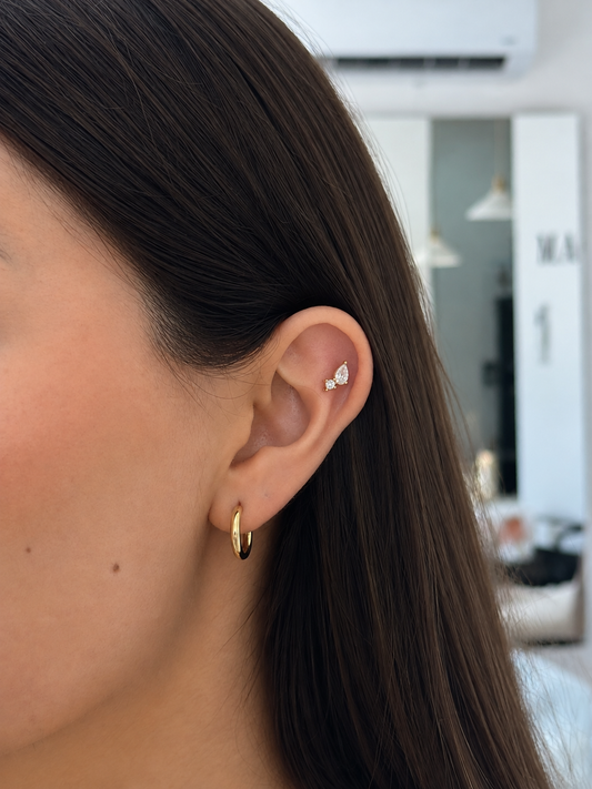Piercing gota punto